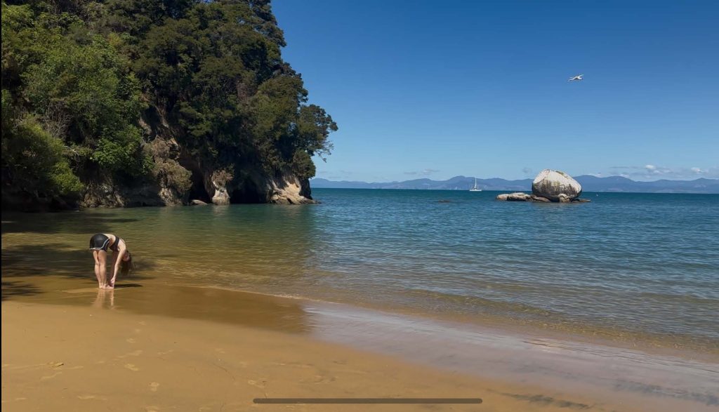 Matilda Caesar dipping her toes in the ocean